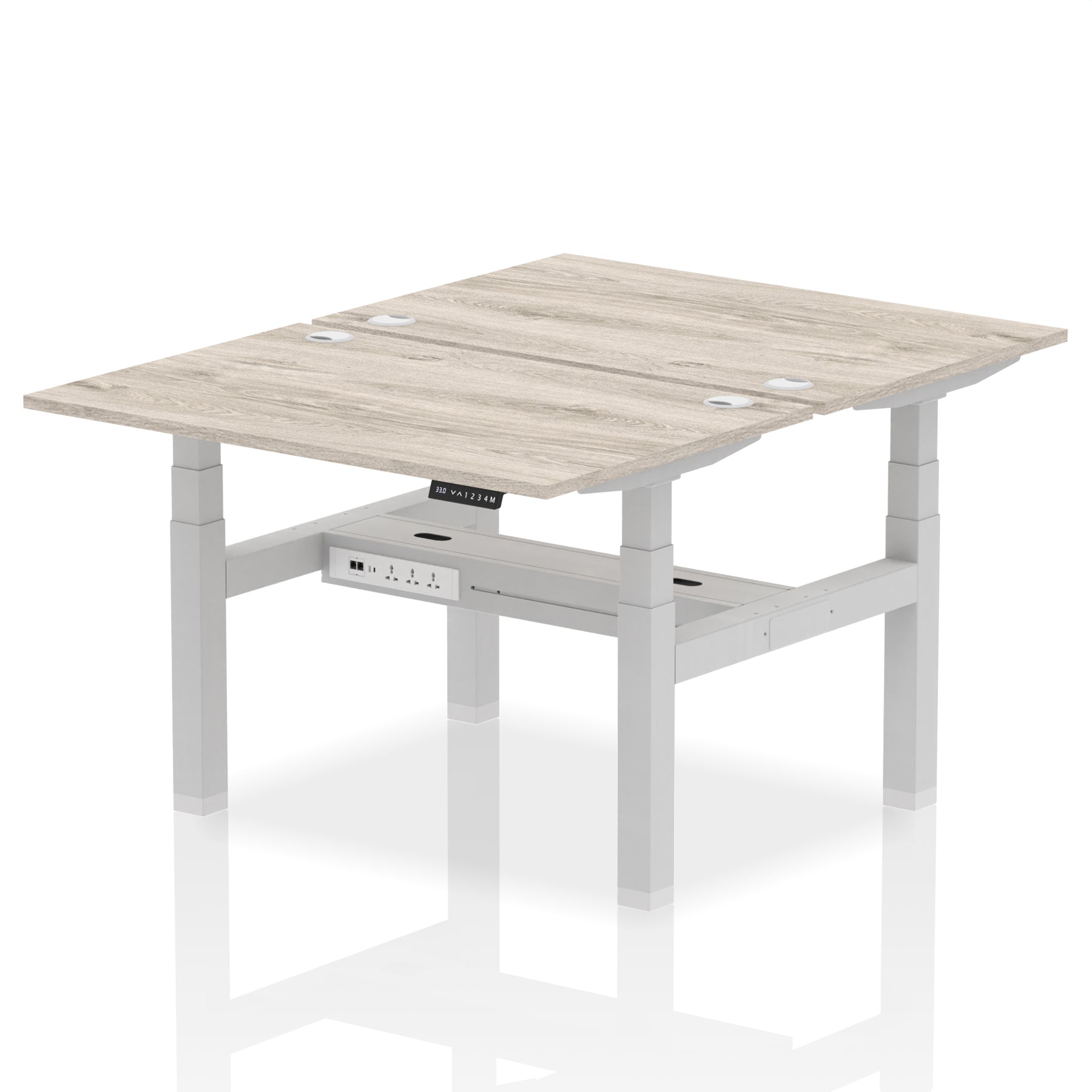 Back-to-back height adjustable desk with wood-effect top and metal frame on a white background