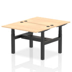Back-to-back height adjustable desk with wood-effect top and metal frame on a white background