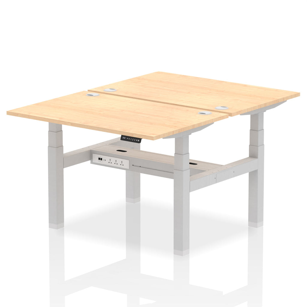 Back-to-back height adjustable desk with wood-effect top and metal frame on a white background