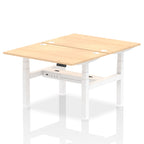 Back-to-back height adjustable desk with wood-effect top and metal frame on a white background