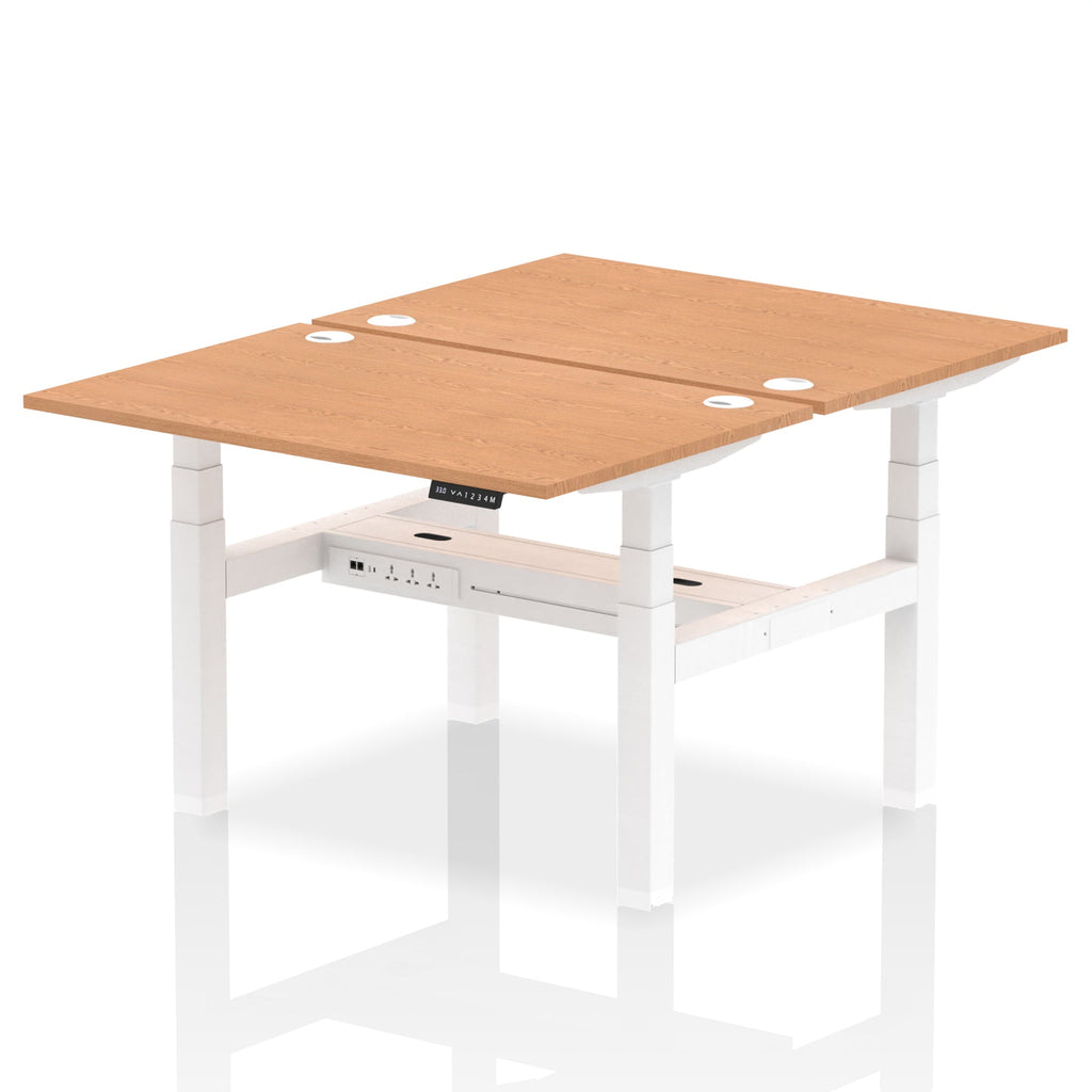 Back-to-back height adjustable desk with wood-effect top and metal frame on a white background