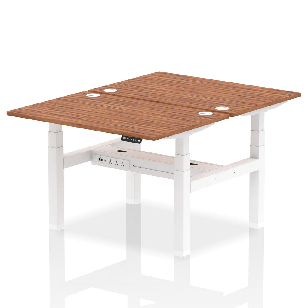 Back-to-back height adjustable desk with wood-effect top and metal frame on a white background