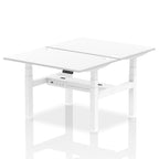 Back-to-back height adjustable desk with white top and metal frame on a white background