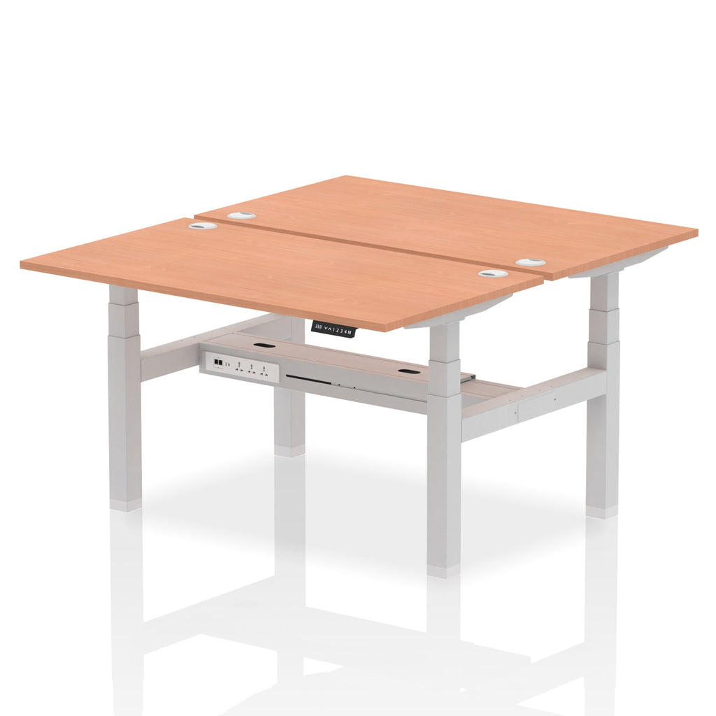 Back-to-back height adjustable desk with wood-effect top and metal frame on a white background