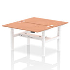 Back-to-back height adjustable desk with wood-effect top and metal frame on a white background