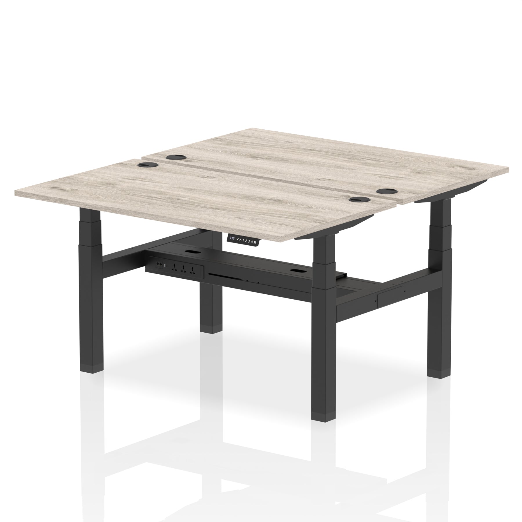Back-to-back height adjustable desk with wood-effect top and metal frame on a white background