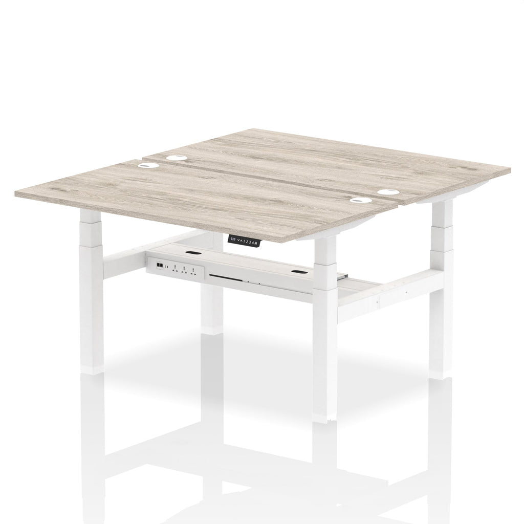 Back-to-back height adjustable desk with wood-effect top and metal frame on a white background
