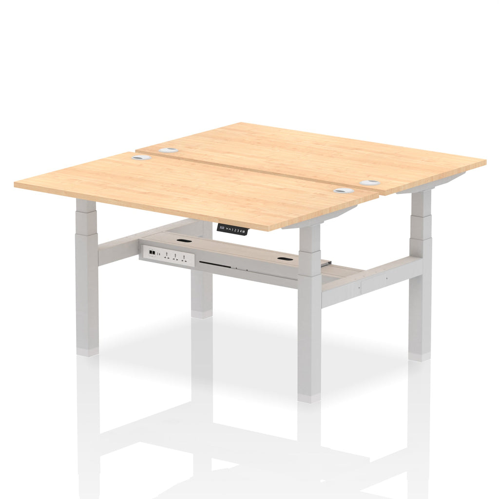 Back-to-back height adjustable desk with wood-effect top and metal frame on a white background