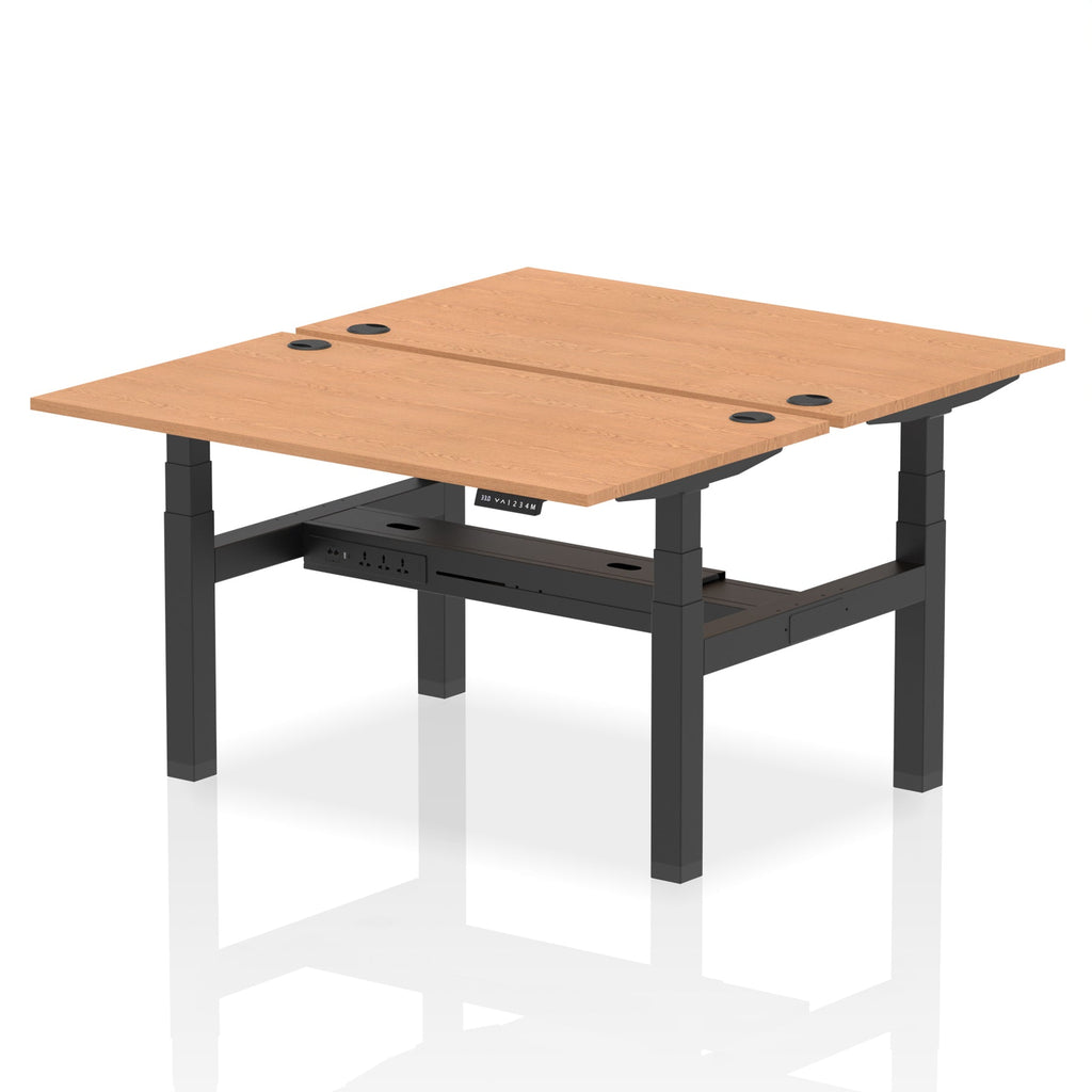 Back-to-back height adjustable desk with wood-effect top and metal frame on a white background