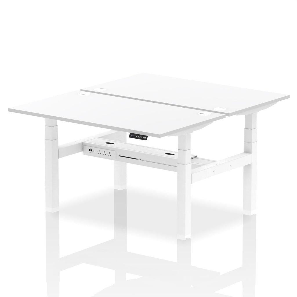 Back-to-back height adjustable desk with white top and metal frame on a white background