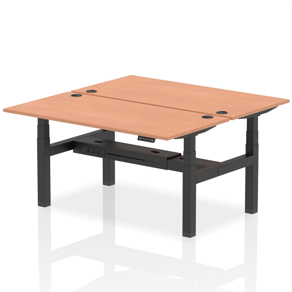 Back-to-back height adjustable desk with wood-effect top and metal frame on a white background