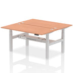 Back-to-back height adjustable desk with wood-effect top and metal frame on a white background