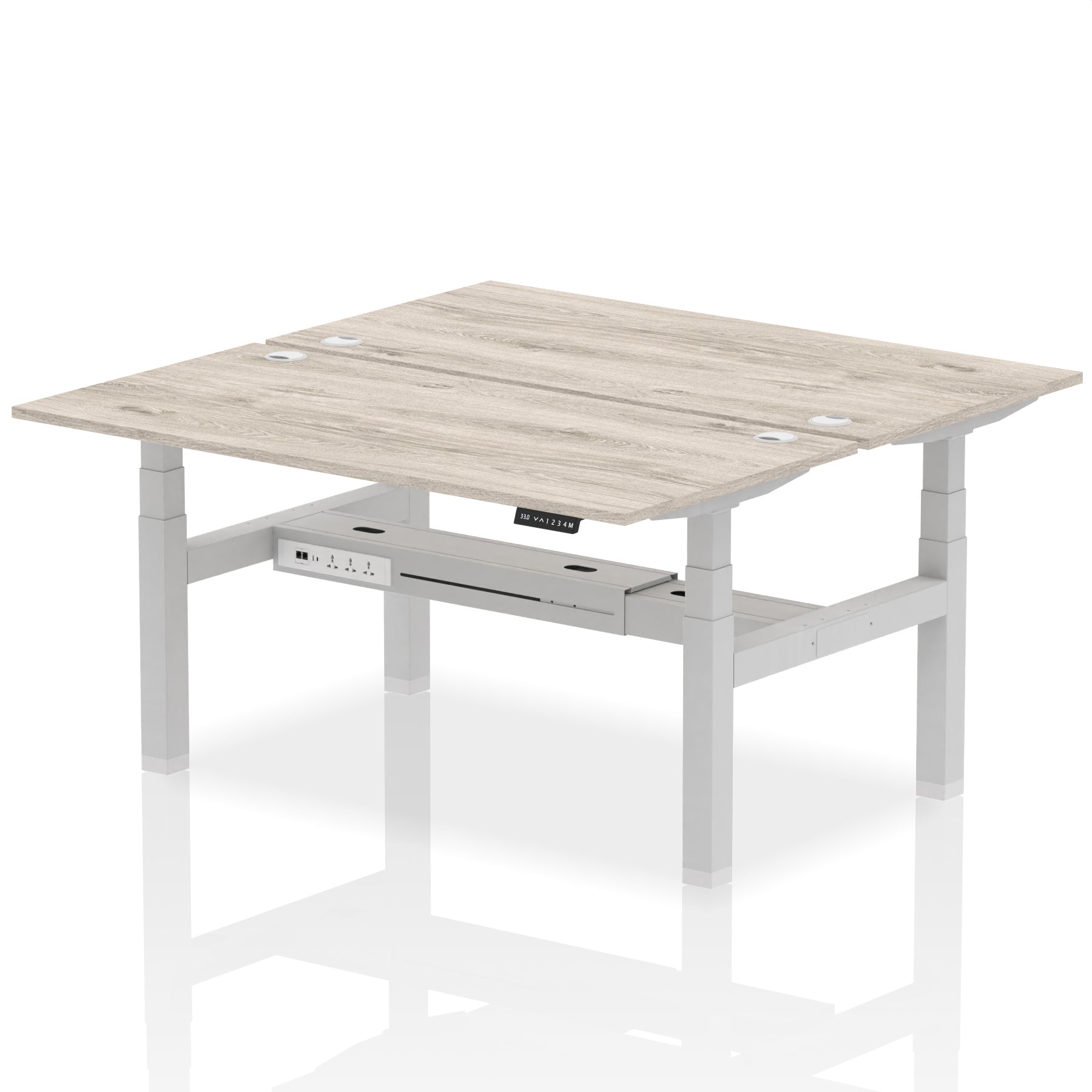 Back-to-back height adjustable desk with wood-effect top and metal frame on a white background