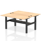 Back-to-back height adjustable desk with wood-effect top and metal frame on a white background