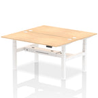Back-to-back height adjustable desk with wood-effect top and metal frame on a white background
