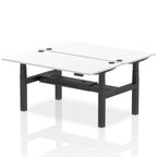Back-to-back height adjustable desk with white top and metal frame on a white background