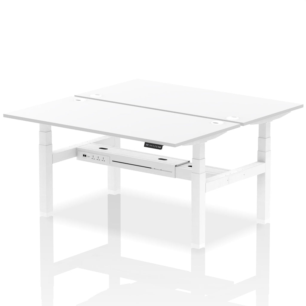 Back-to-back height adjustable desk with white top and metal frame on a white background