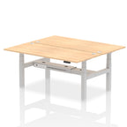 Back-to-back height adjustable desk with wood-effect top and metal frame on a white background
