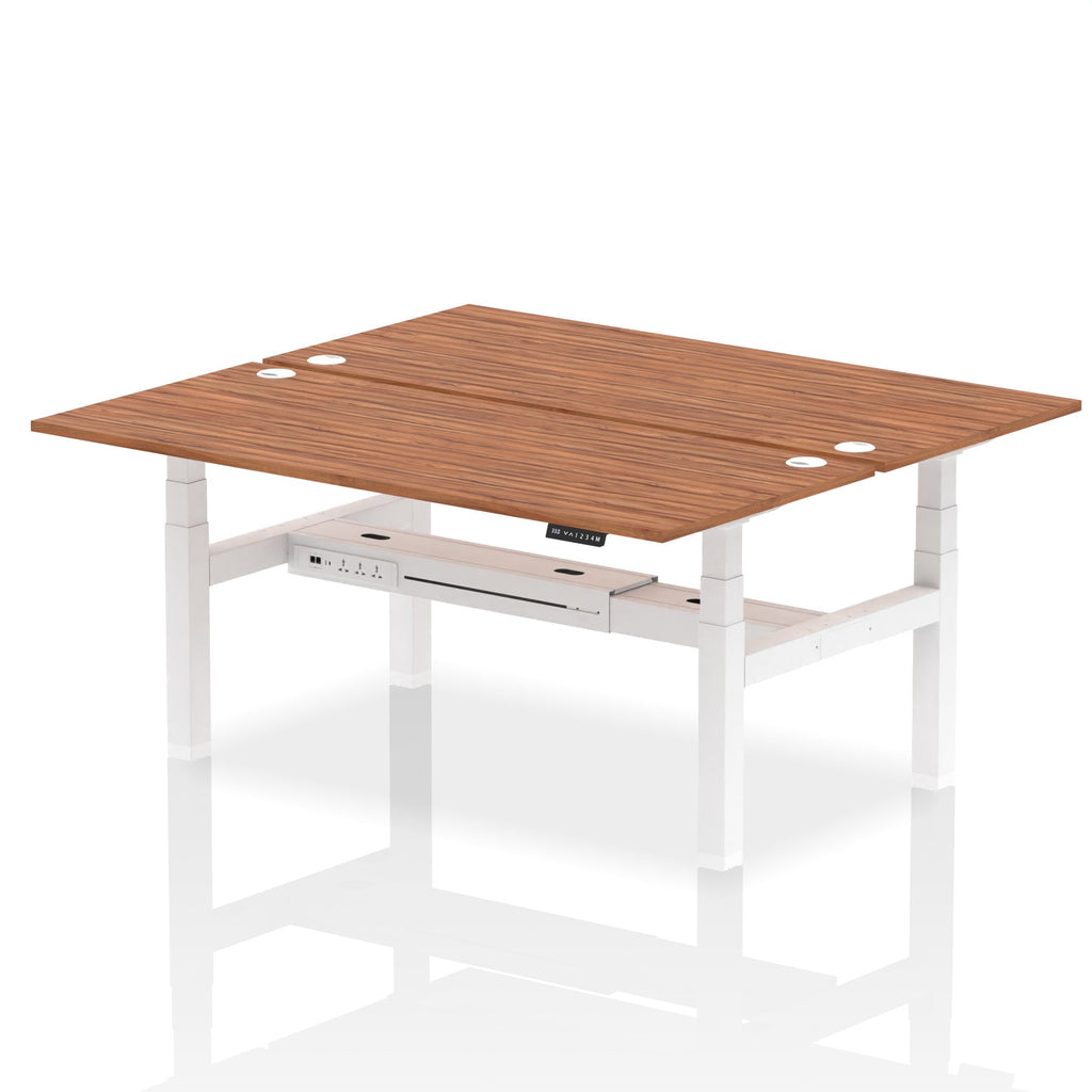 Back-to-back height adjustable desk with wood-effect top and metal frame on a white background