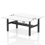 Back-to-back height adjustable desk with white top and metal frame on a white background