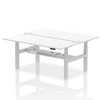 Back-to-back height adjustable desk with white top and metal frame on a white background