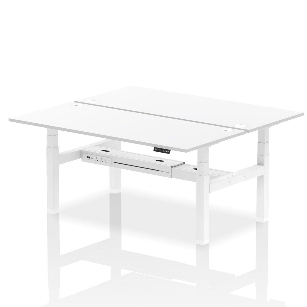 Back-to-back height adjustable desk with white top and metal frame on a white background