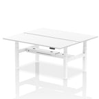 Back-to-back height adjustable desk with white top and metal frame on a white background