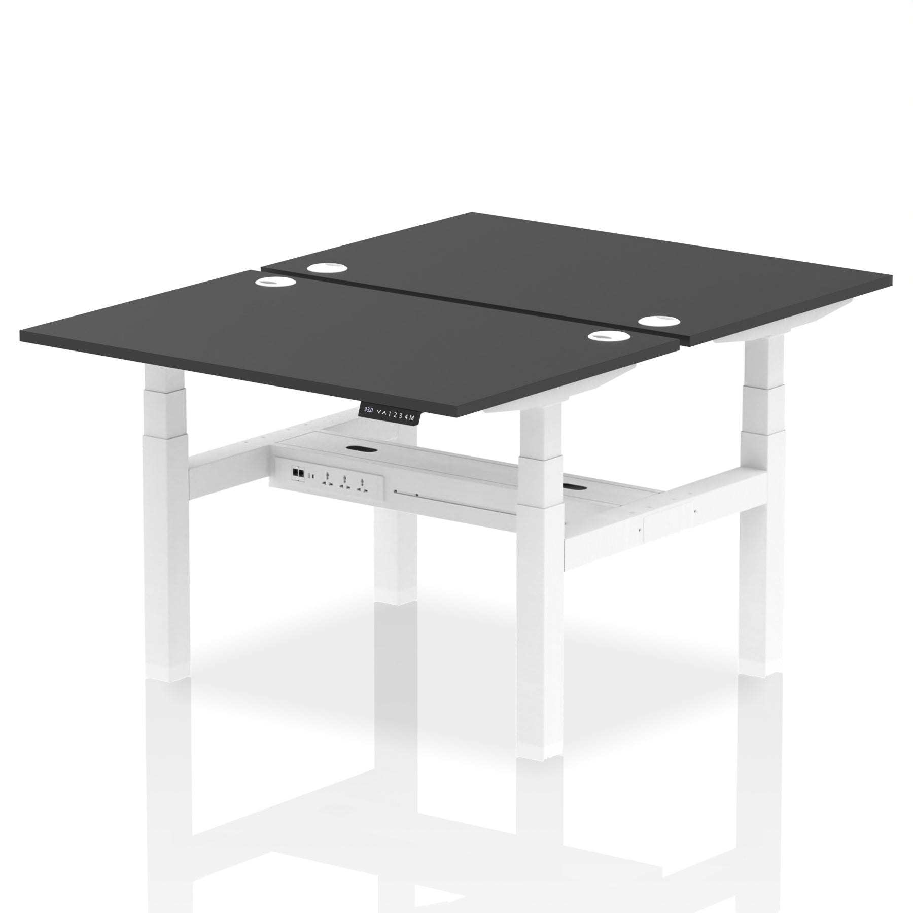 Back-to-back height adjustable desk with black top and metal frame on a white background