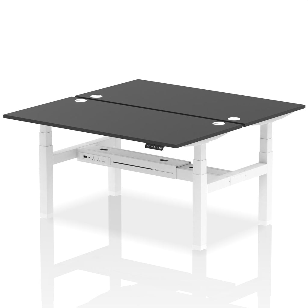 Back-to-back height adjustable desk with black top and metal frame on a white background