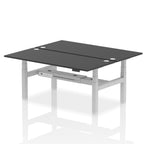 Back-to-back height adjustable desk with black top and metal frame on a white background