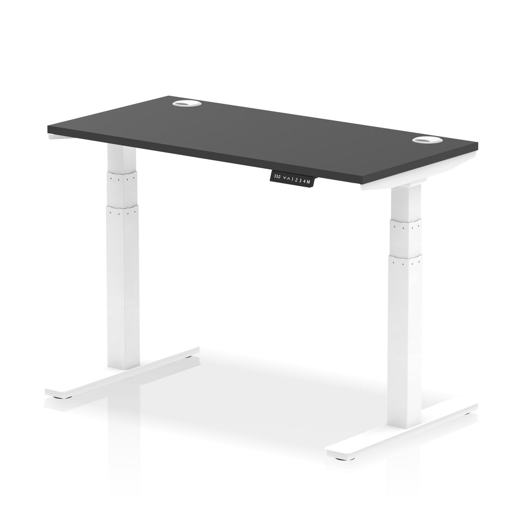 Adjustable height desk with black top and metal legs on a white background