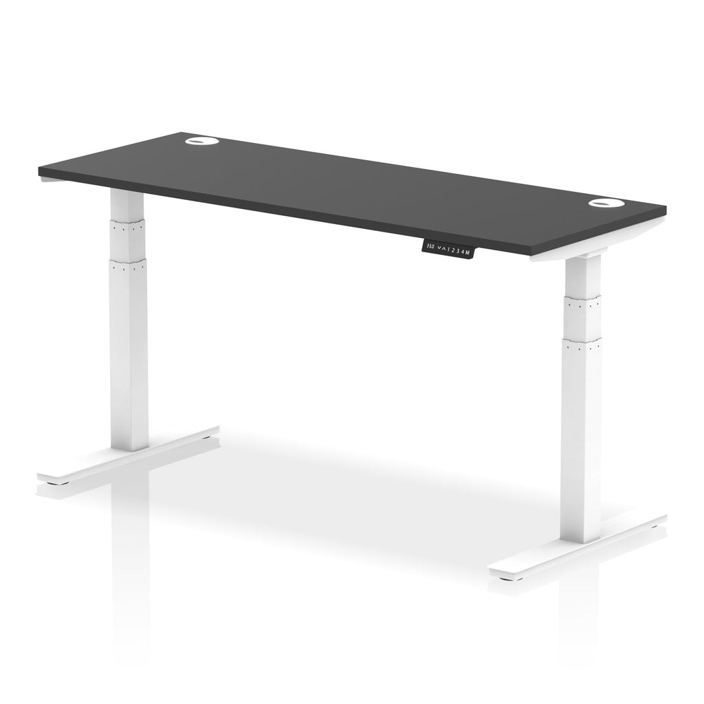 Adjustable height desk with black top and metal legs on a white background
