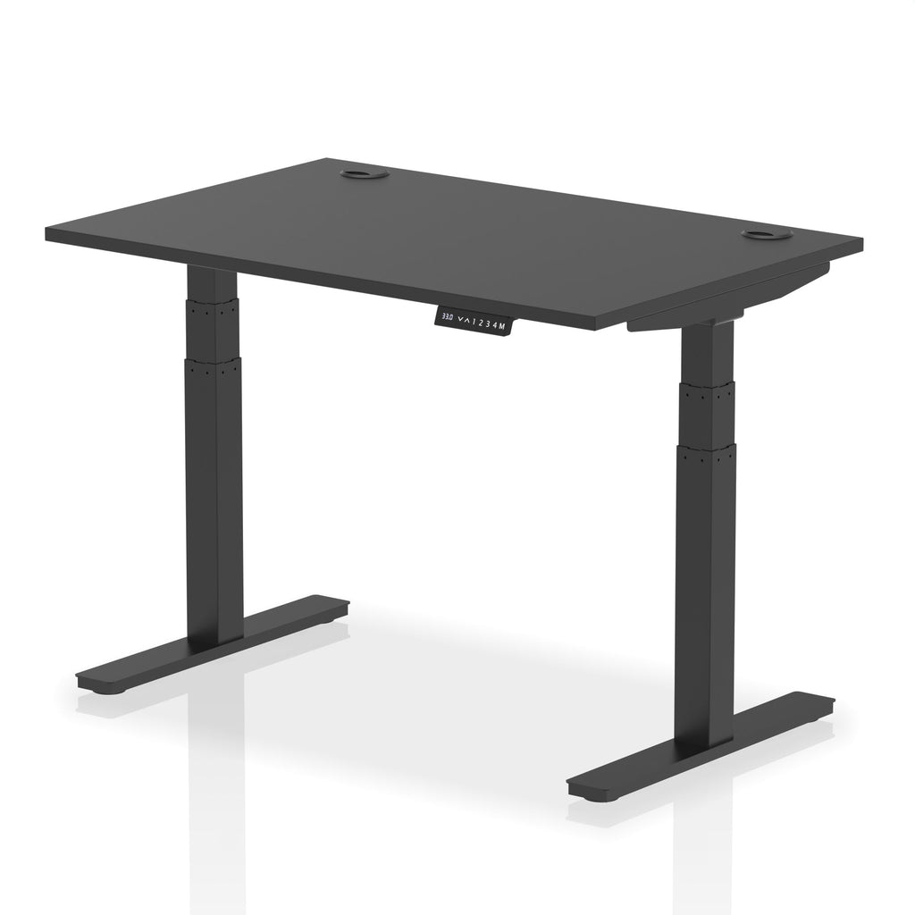 Adjustable height desk with black top and metal legs on a white background