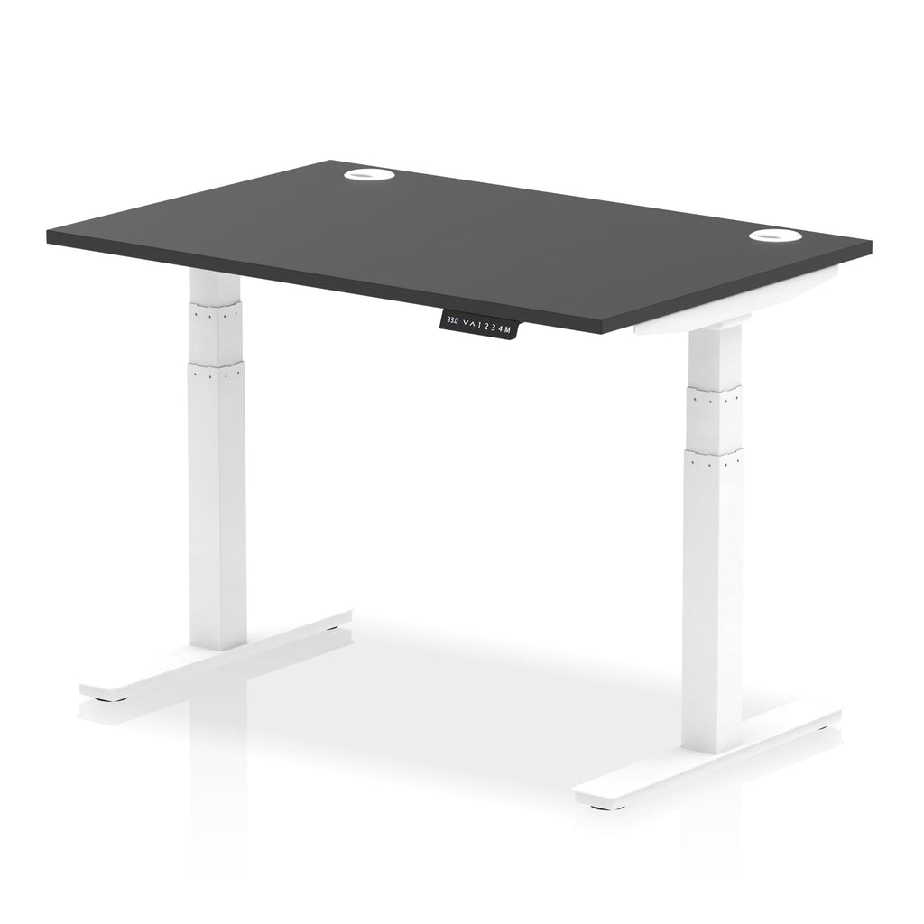Adjustable height desk with black top and metal legs on a white background