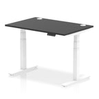 Adjustable height desk with black top and metal legs on a white background