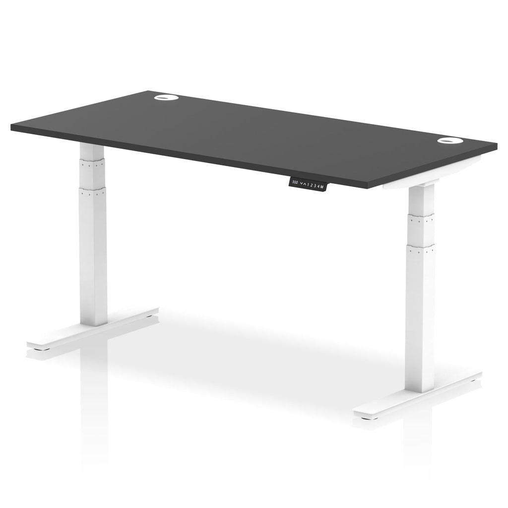 Adjustable height desk with black top and metal legs on a white background