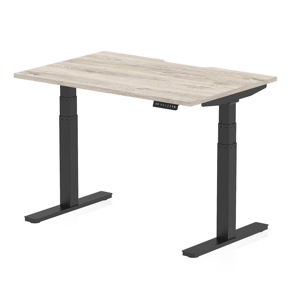 Height adjustable desk with wood-effect top and black frame on a white background