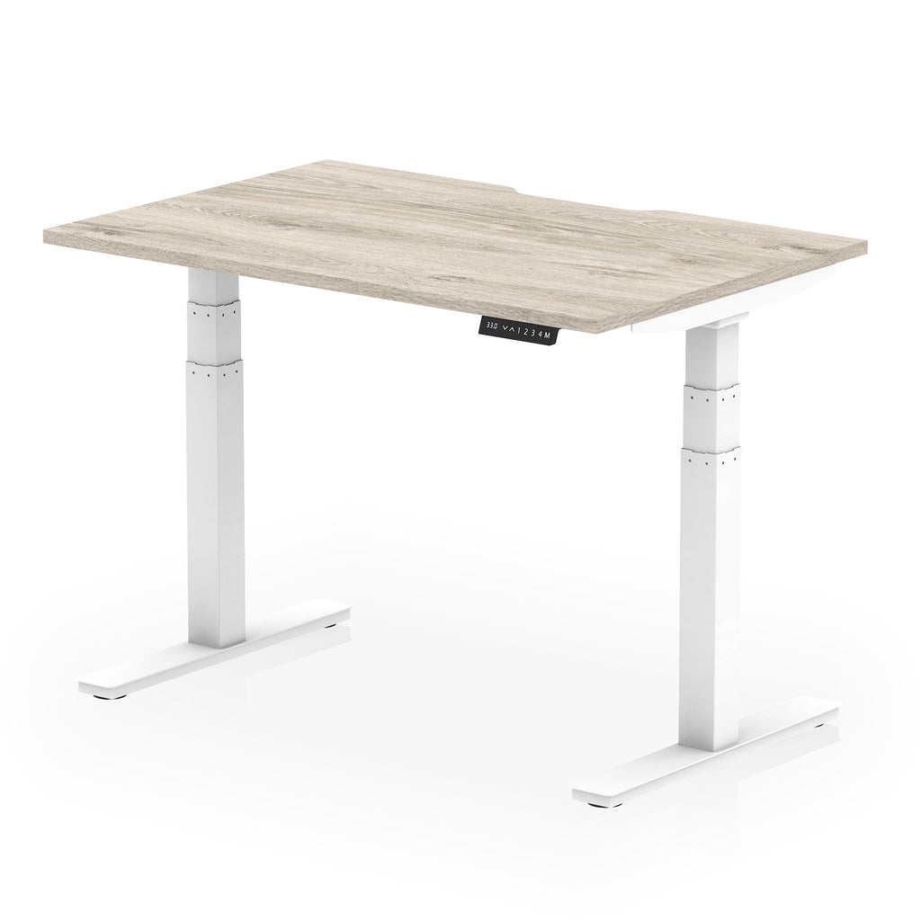 Height adjustable desk with wood-effect top and white frame on a white background