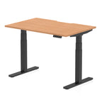 Height adjustable desk with wood-effect top and black frame on a white background