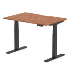 Height adjustable desk with wood-effect top and black frame on a white background