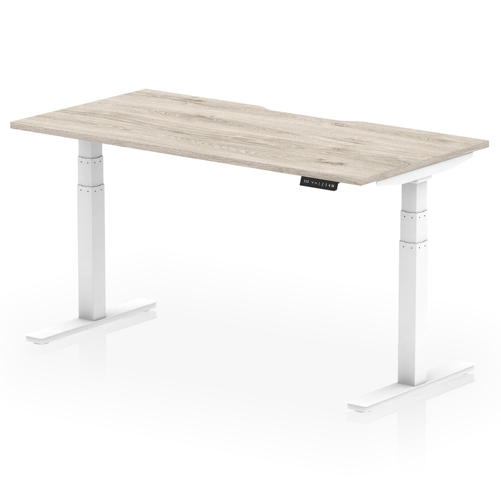 Height adjustable desk with wood-effect top and white frame on a white background