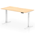 Height adjustable desk with wood-effect top and white frame on a white background