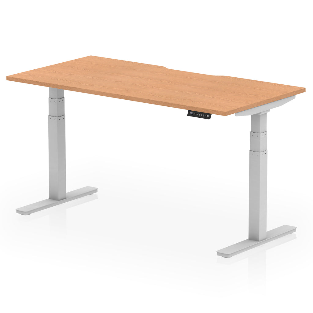 Height adjustable desk with wood-effect top and silver frame on a white background