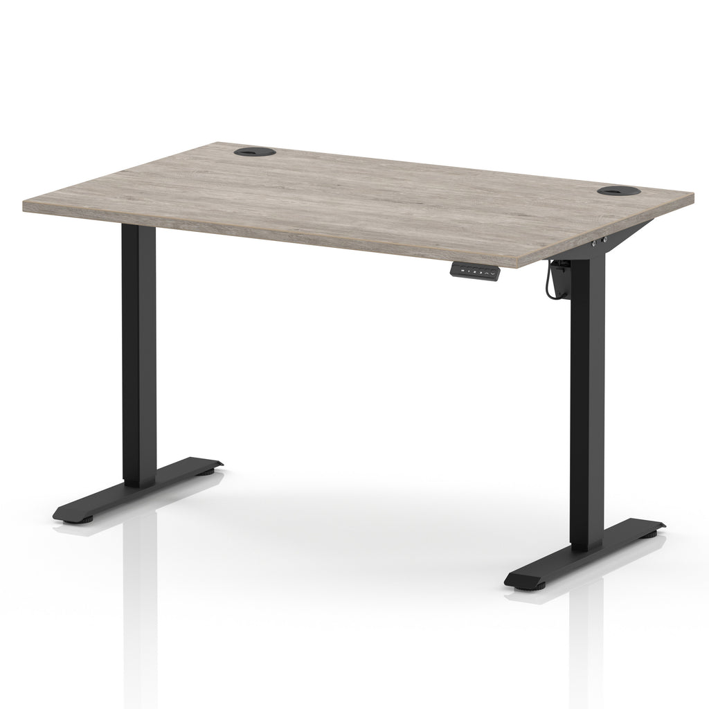 An adjustable height standing desk with a light grey wood-grain desktop and black metal legs, shown on a white background.