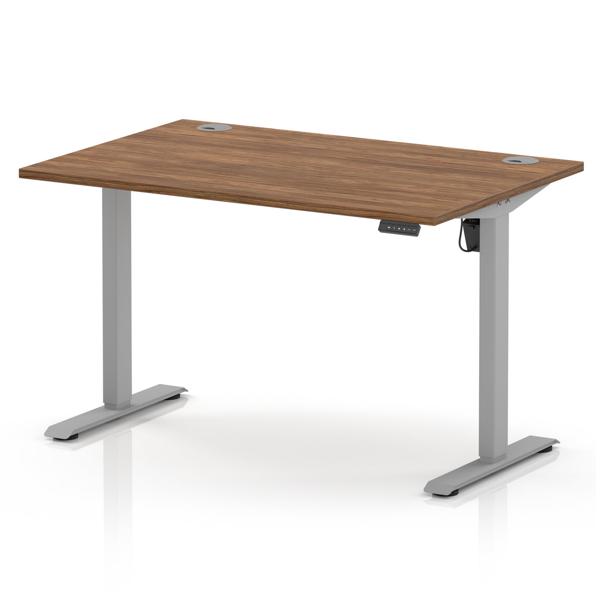 An adjustable height standing desk with a medium brown wood-grain desktop and a silver metal frame with T-style legs, shown on a white background.