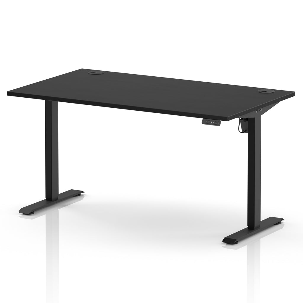 A modern black height-adjustable standing desk with a rectangular top and T-style metal legs, shown on a clean white background with a subtle reflection.