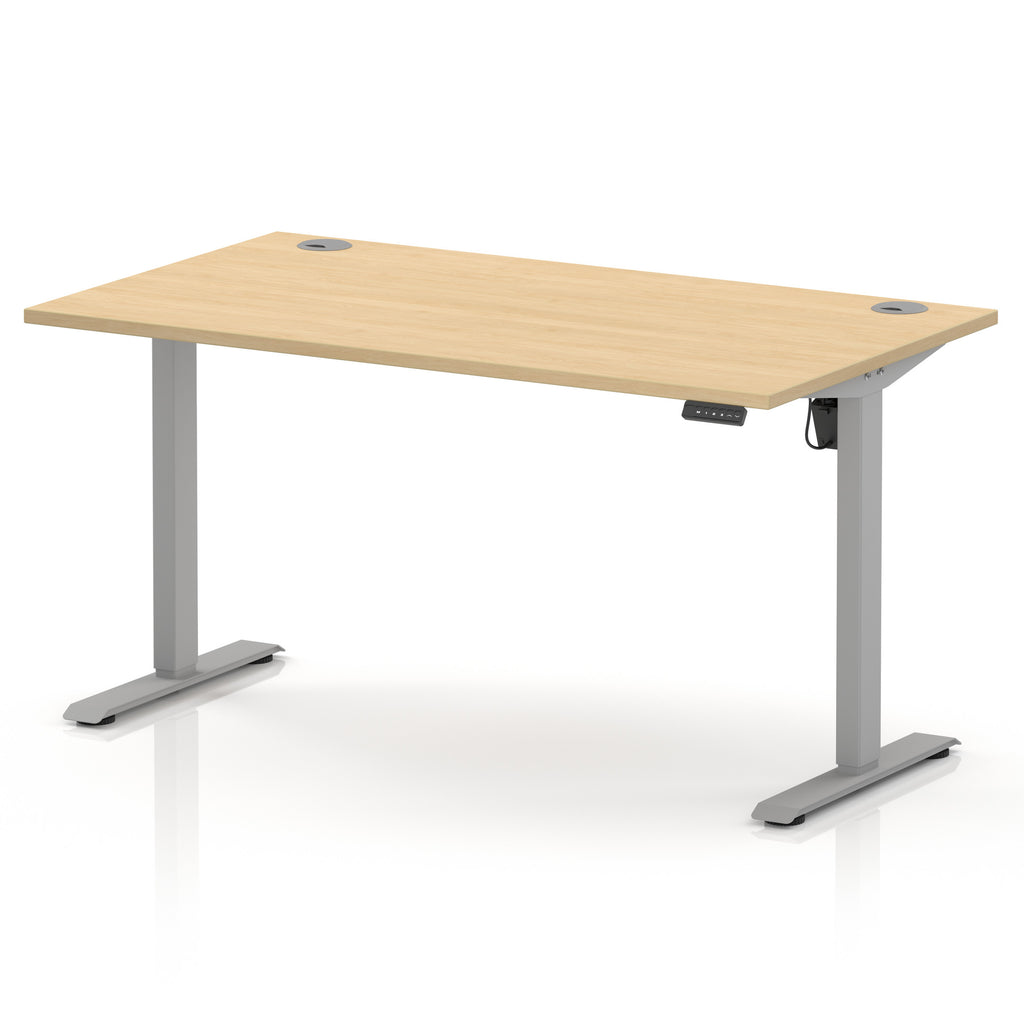 An adjustable height standing desk with a light natural wood grain top and a silver metal frame with T-style legs, shown on a white background.