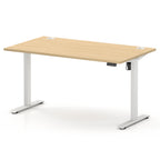 An adjustable height standing desk with a light natural wood grain top and white metal legs, shown on a clean white background.