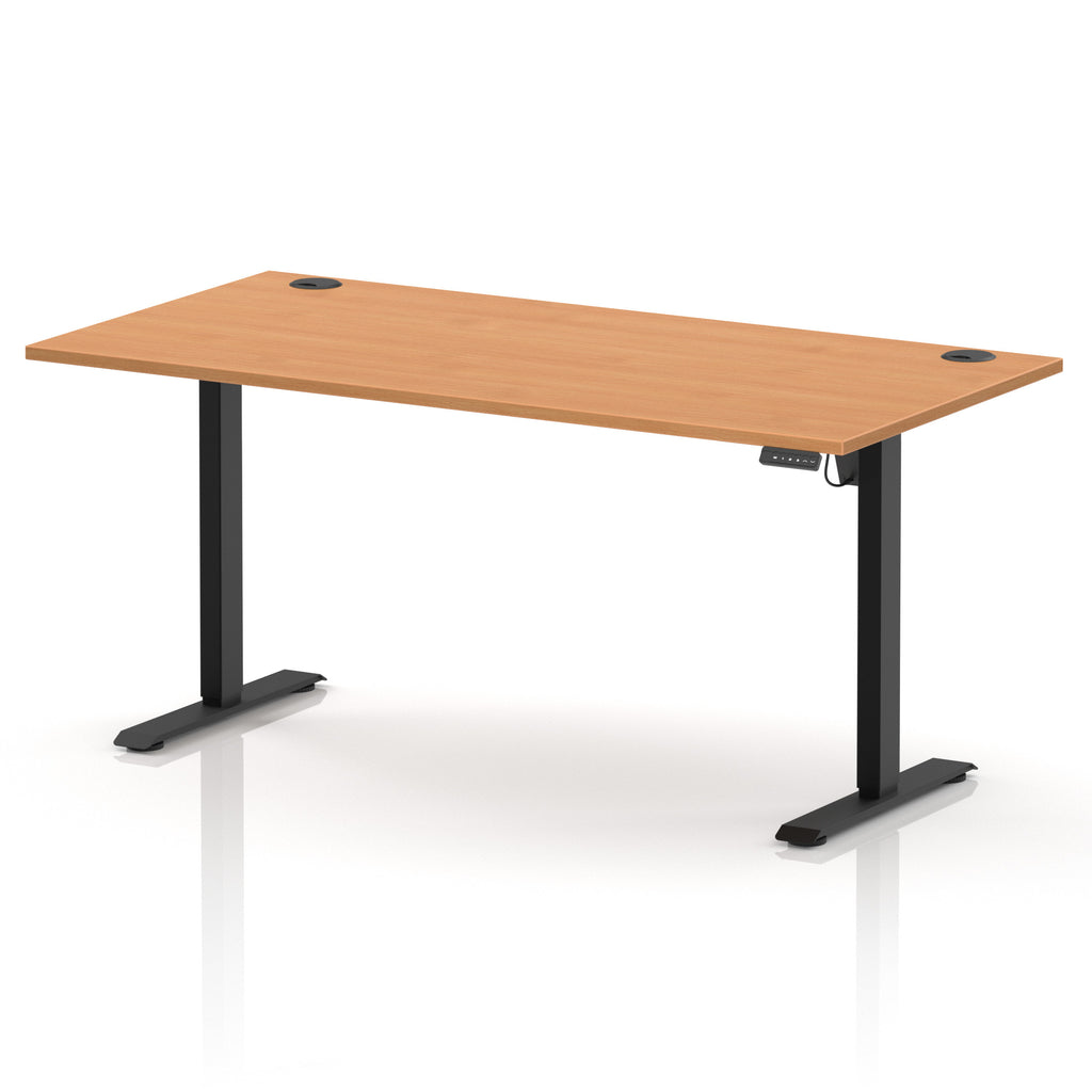 An adjustable standing desk with a light brown wood-grain desktop and black metal legs, shown on a clean white background with a subtle reflection.