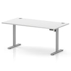A modern height-adjustable standing desk with a white rectangular desktop and silver metal legs, shown on a clean white background.